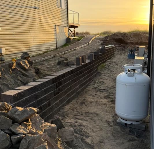 Retaining wall installation progress with site grading in Tacoma WA