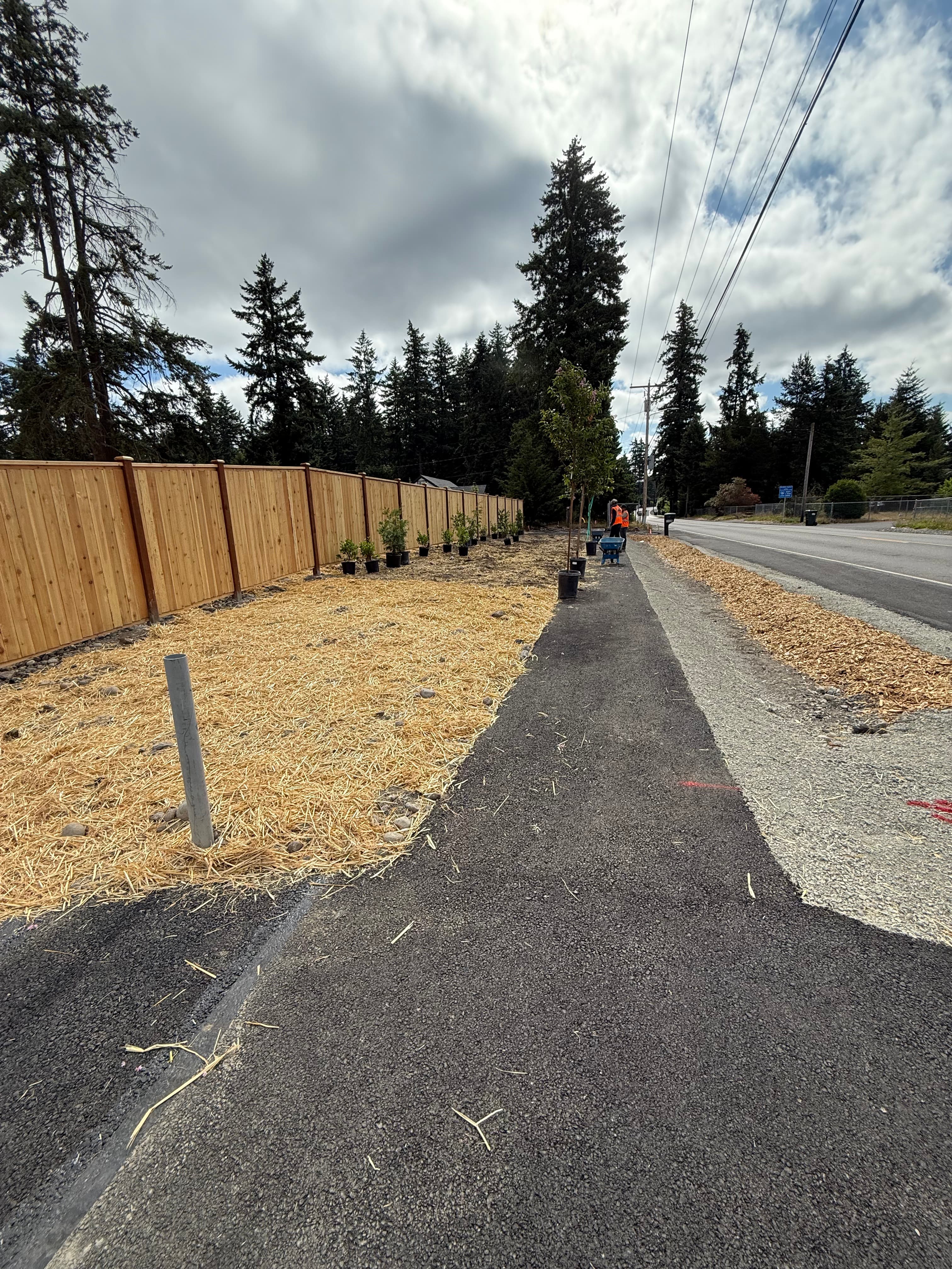 Fence line drainage routing during install in Pierce County WA