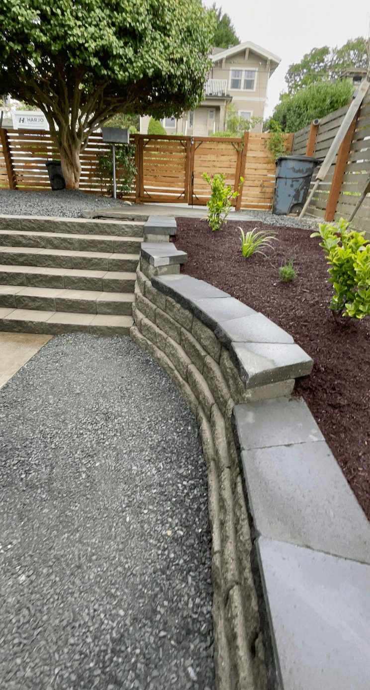 Curved retaining wall detail with stair transition in Tacoma WA